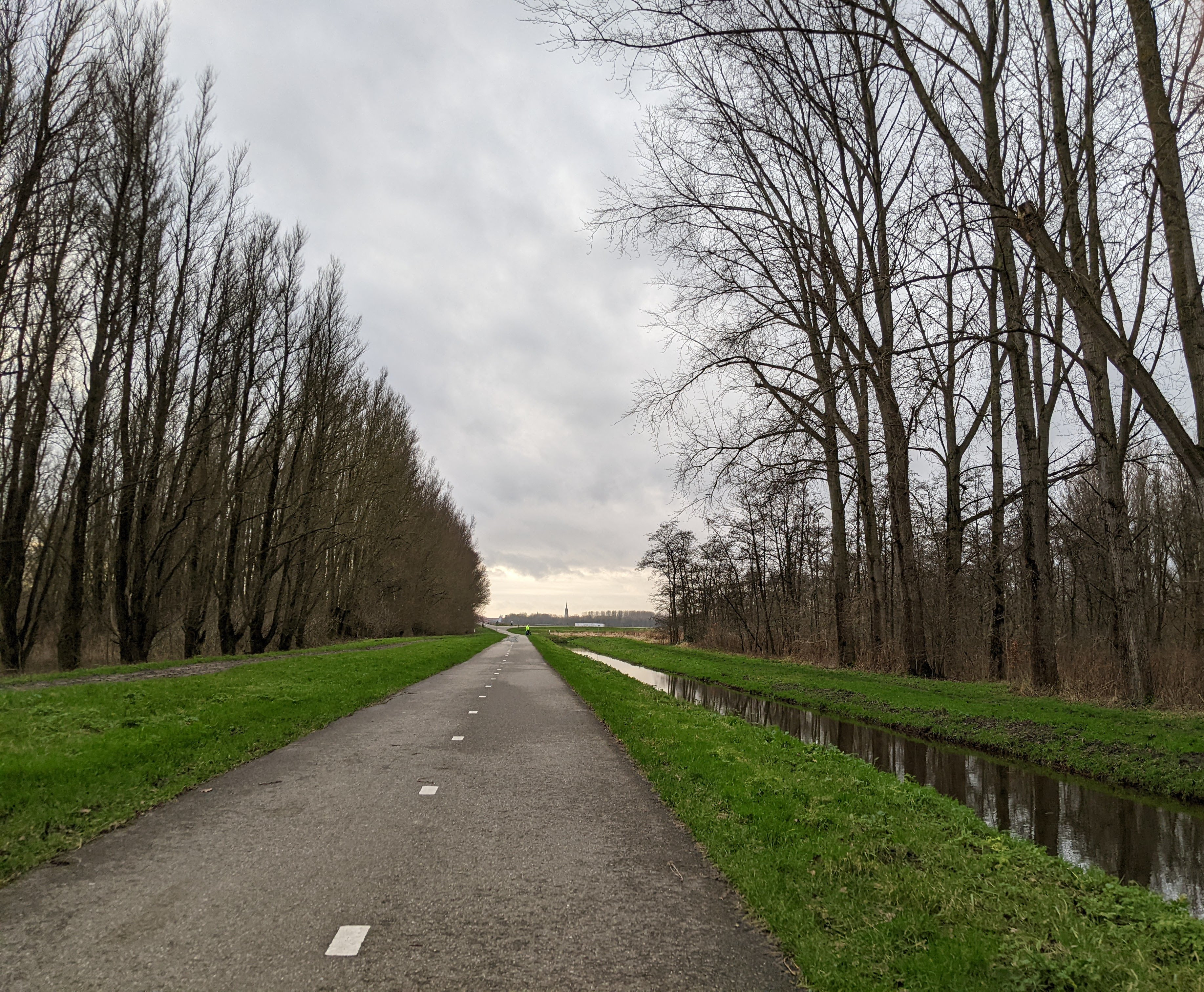 a picture of Delft with Jen in the distance