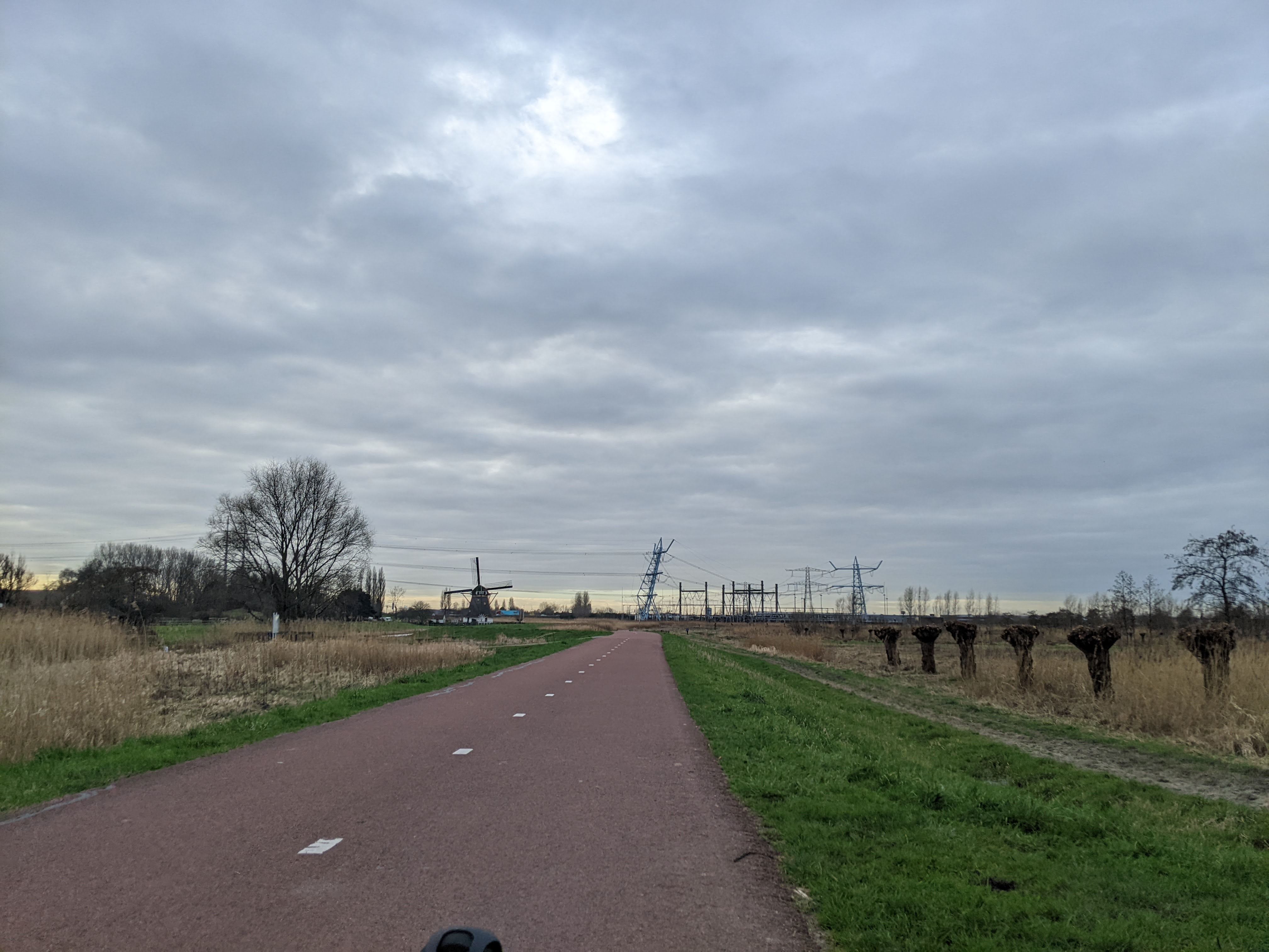 flat land, bike path, windmill, power lines