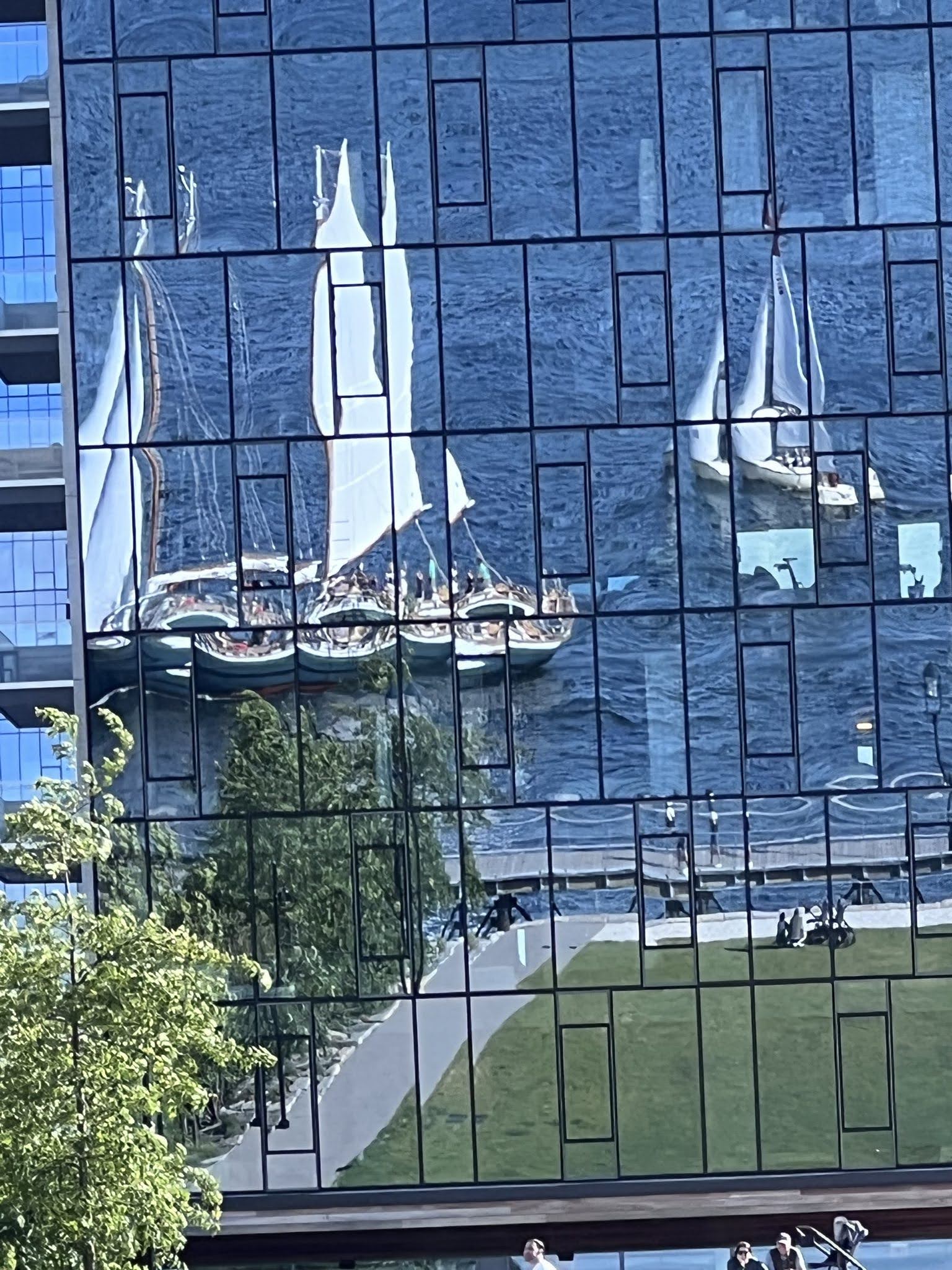 boats reflected in a building